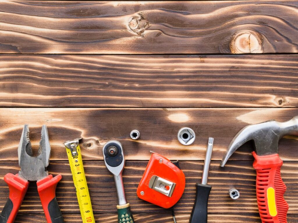 Real photo of hand tools on workbench.