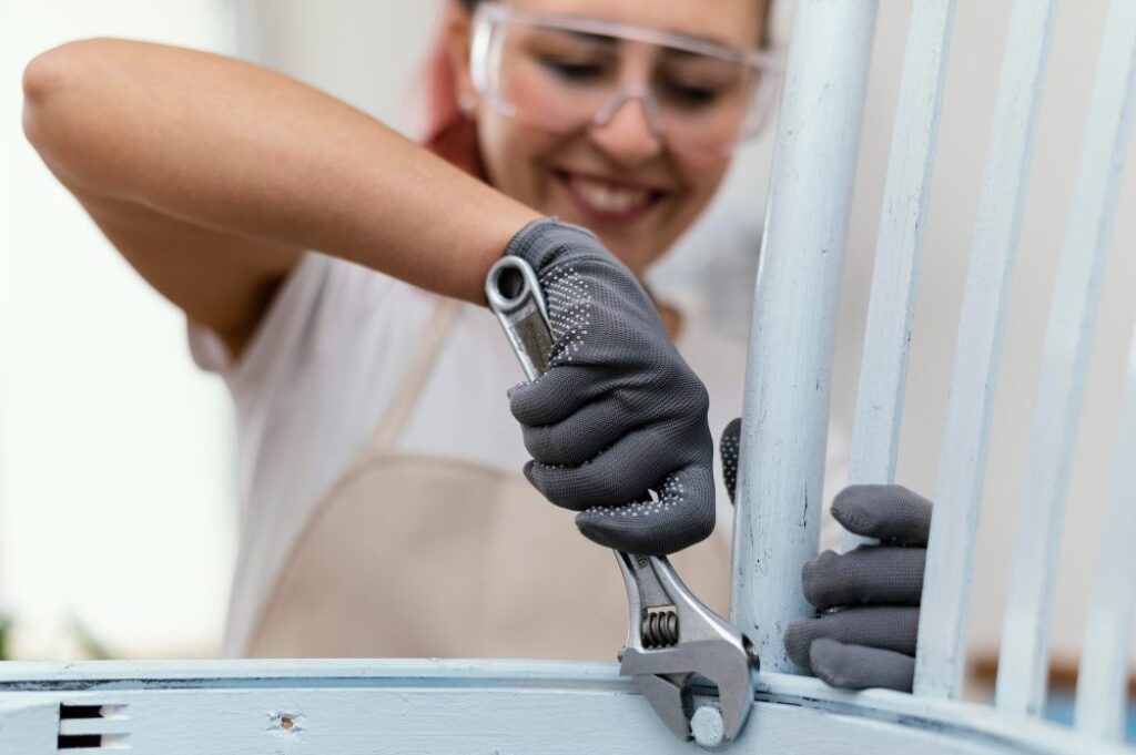 Homeowner repairing chair with adjustable wrench